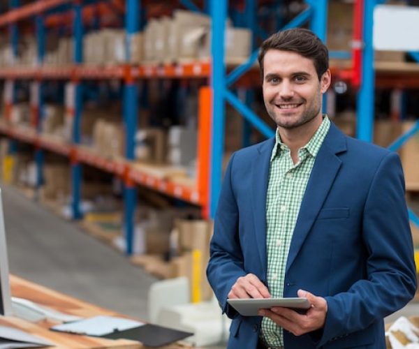 working-man-holding-tablet-checking-inventory-warehouse-workstation-copy-space_13339-380508